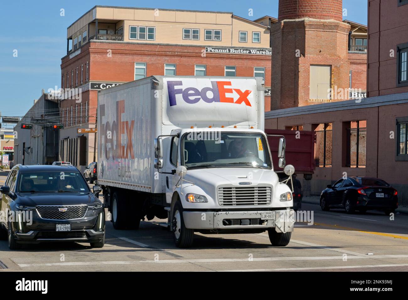 Galveston, Texas - February 2023: Federal Express FedEx delivery truck driving on one of the city's streets Stock Photo