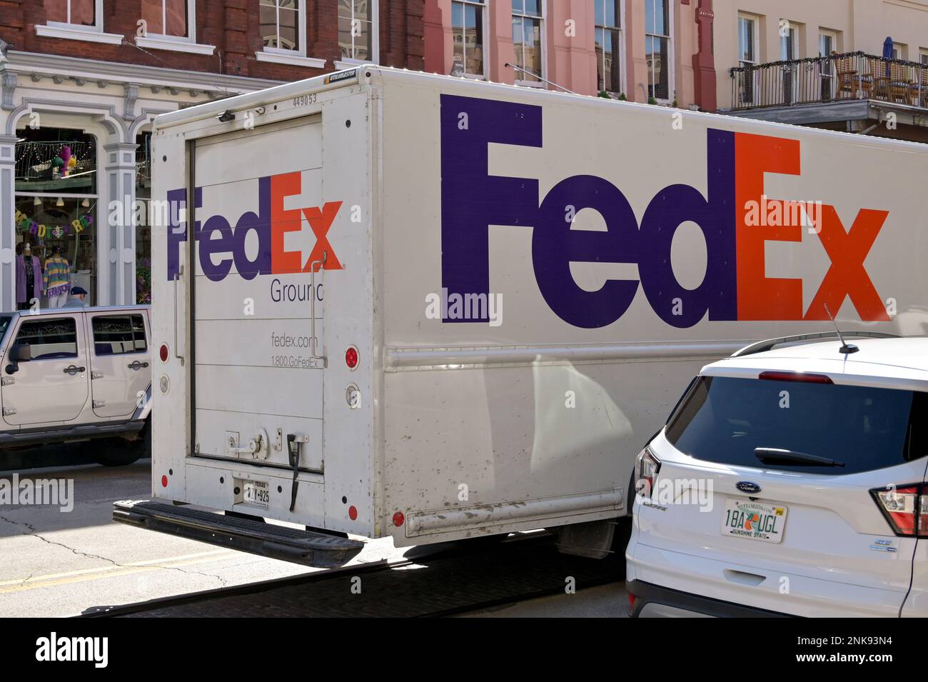 Galveston, Texas - February 2023: Federal Express FedEx delivery truck stopped on a city street to make a delivery Stock Photo