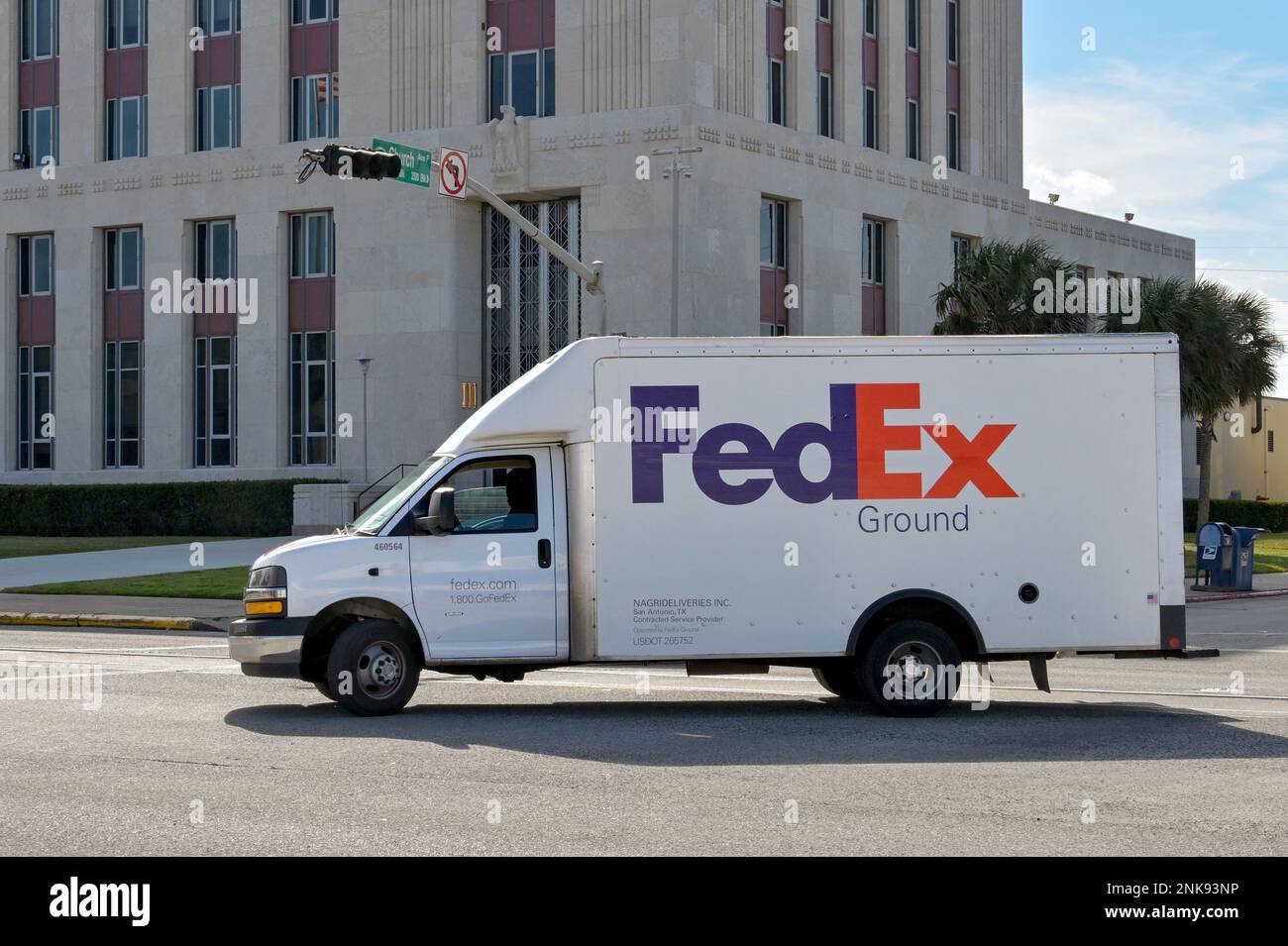 Galveston, Texas - February 2023: Federal Express FedEx delivery truck driving on one of the city's streets Stock Photo