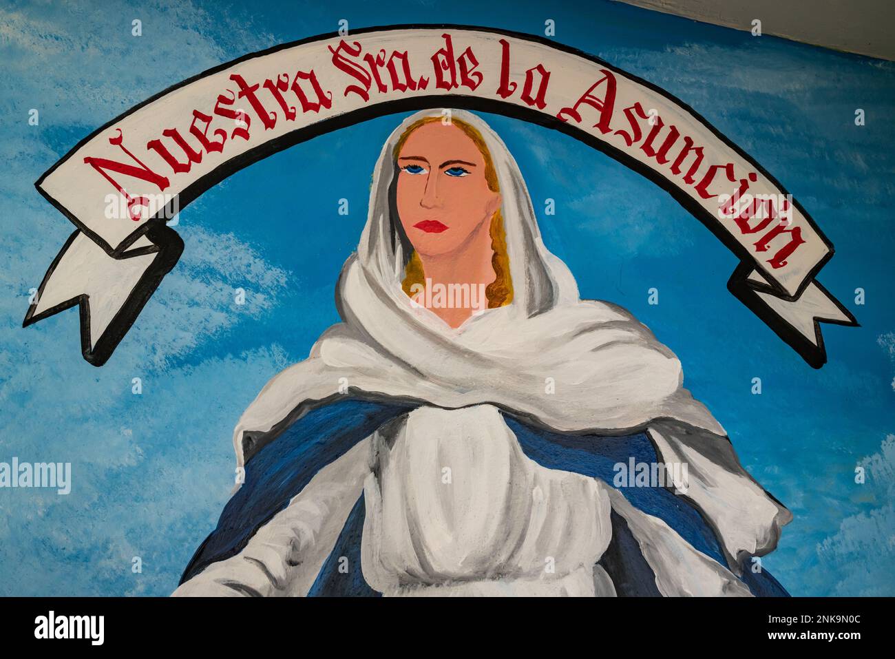 A painted mural of Our Lady of the Assumption on a wall in Santa Maria ...