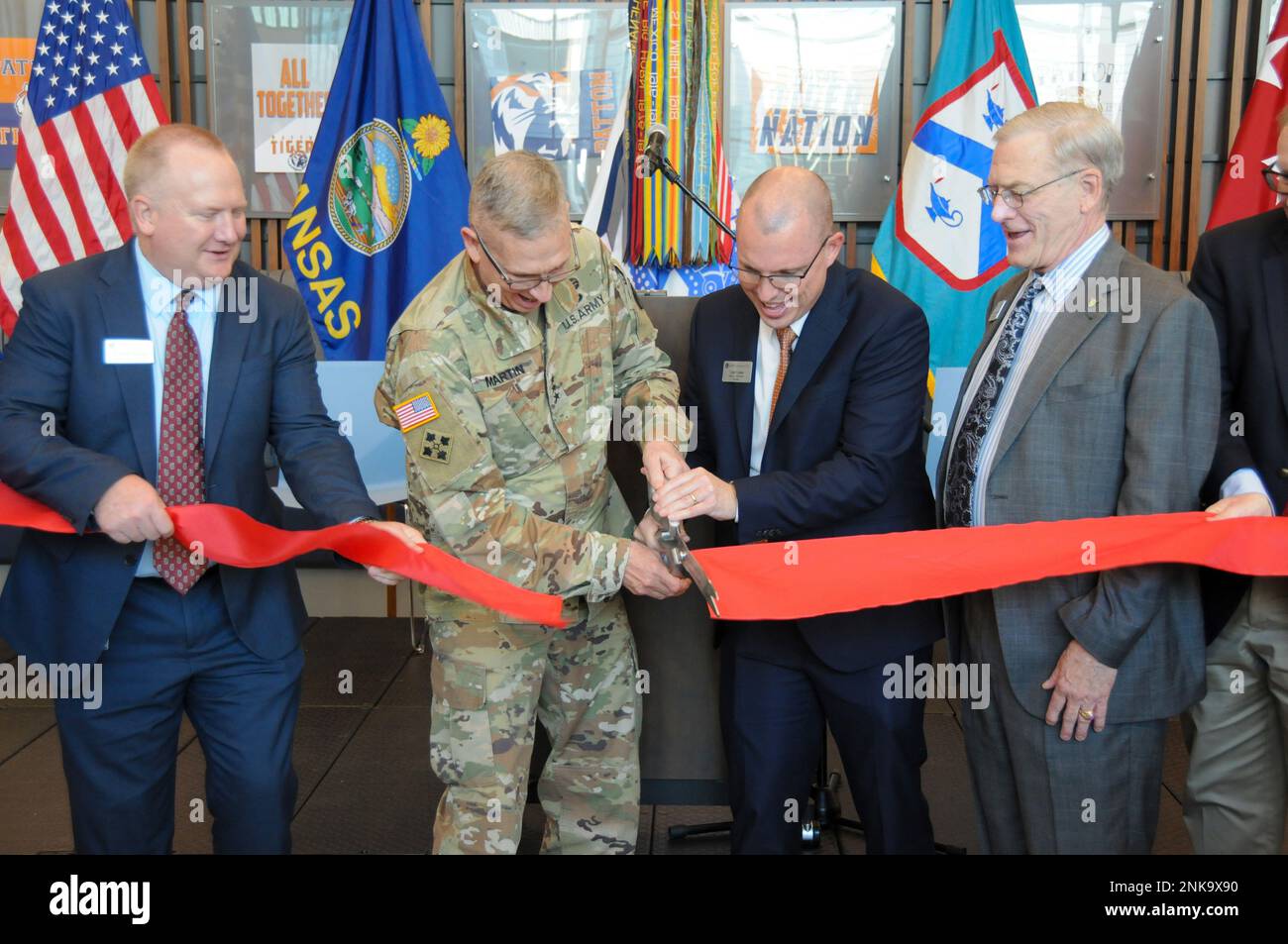 Lt. Gen. Theodore D. Martin (second from left), commanding general for the U.S. Army Combined Arms Center and Fort Leavenworth, along with Dr. Keith Mispagel (left), superintendent for Fort Leavenworth USD 207, Tyler Fowler (second from right), Patton Junior High School principal, and Myron Griswold (right), president of the Fort Leavenworth USD 207 Board of Education, cut the ribbon for the new Patton Junior High School on Fort Leavenworth.  In November 2018, the Fort Leavenworth Board of Education began the process of replacing the original Patton Junior High School which was built in 1958. Stock Photo