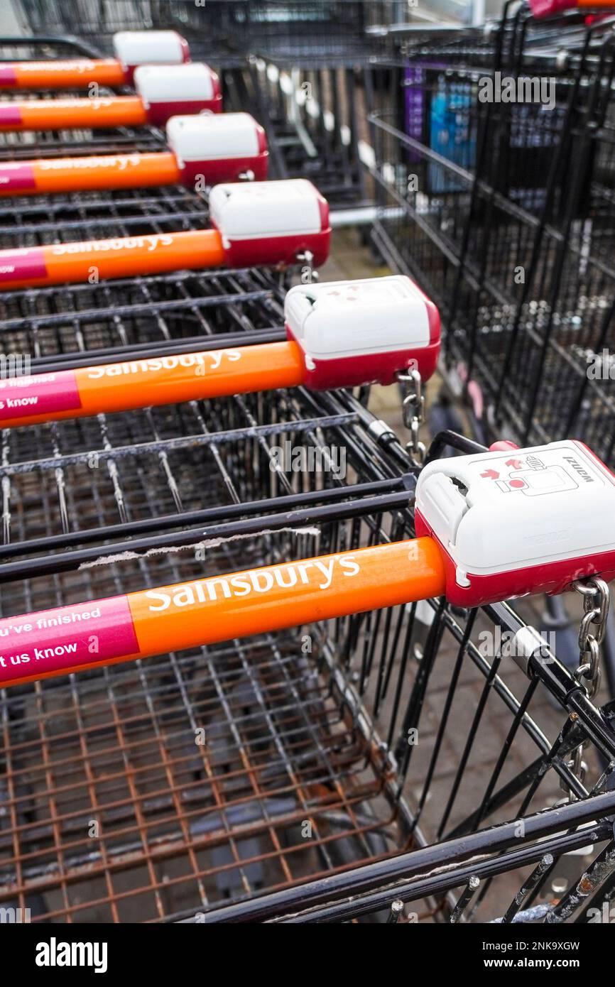 Shopping trolleys stacked outside a Sainsbury's supermarket, Stock Photo