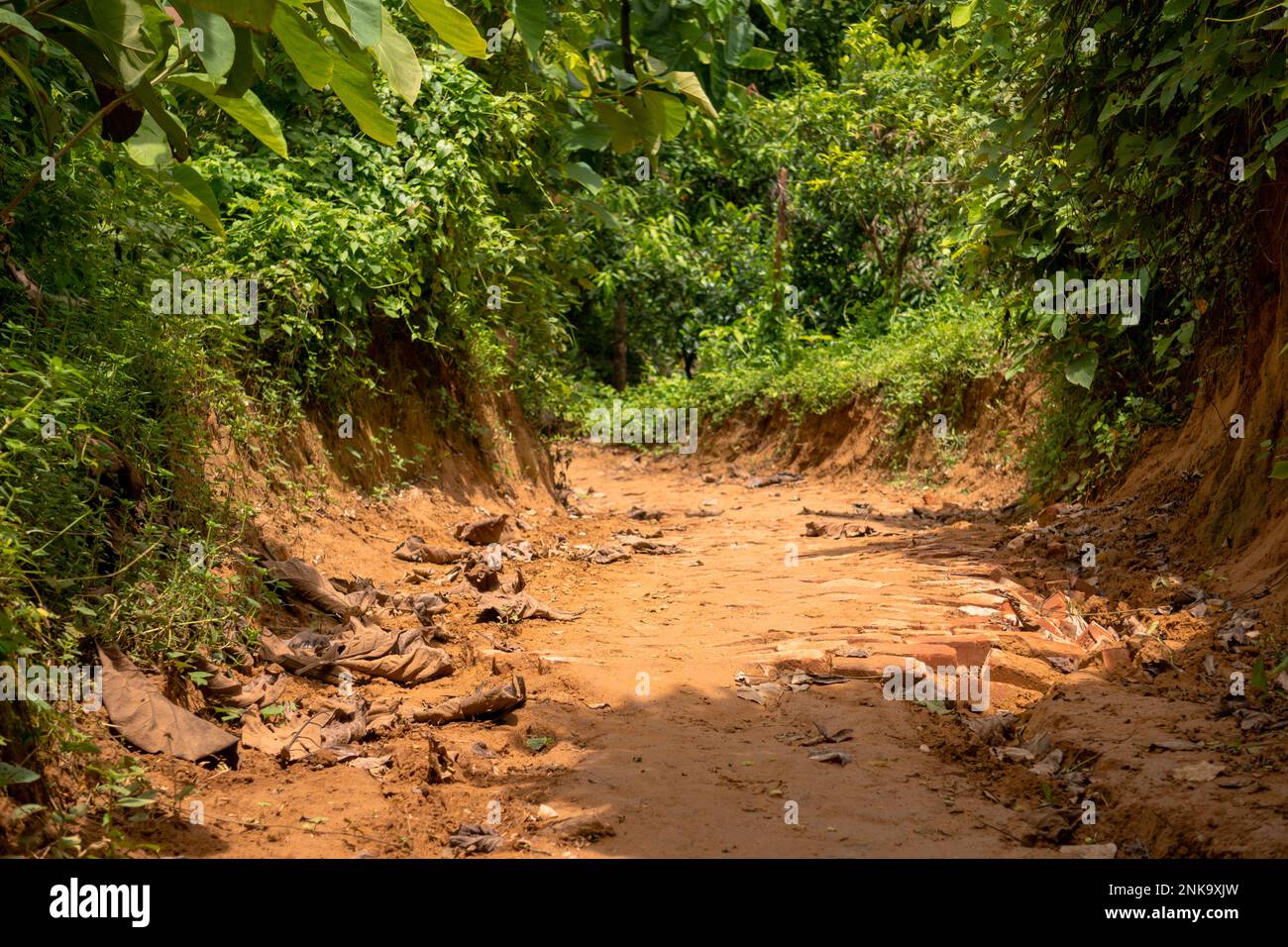 Broken mountain road after rain. Slippery and broken roads in the mountainous region of Bangladesh. Photo taken from Meghla, Bandarban, Chittagong, Ba Stock Photo