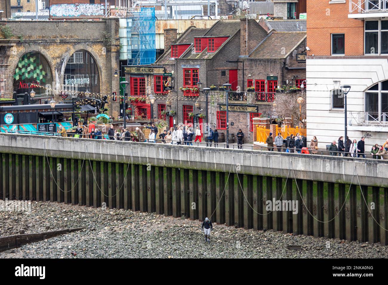 Anchor Bankside Pub and rocky riverbed of River Thames during low tide in Southwark district of London, England Stock Photo