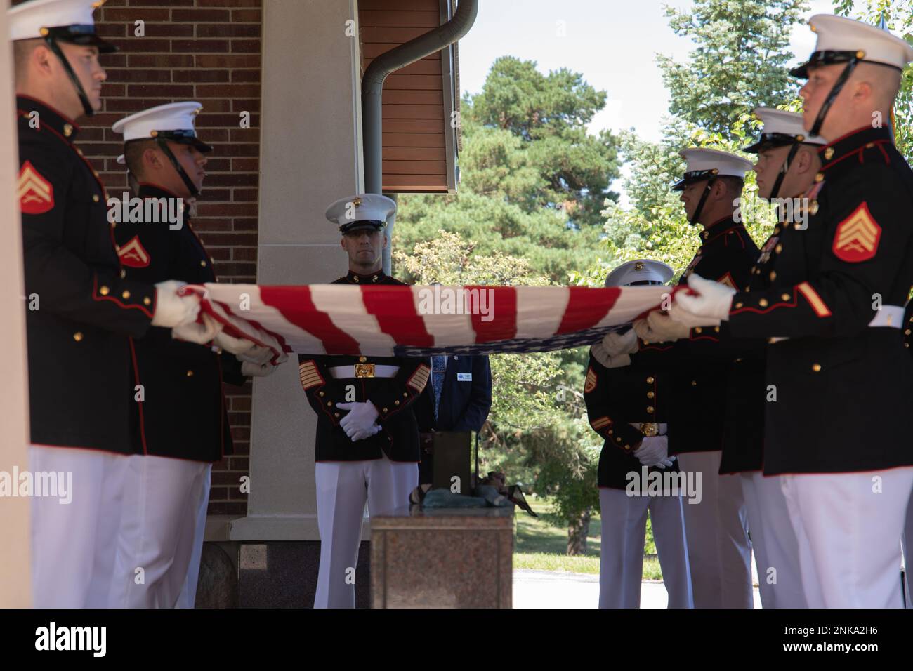 U.S. Marine Corps Body Bearers assigned to Marine Barracks Washington, D.C., support a full honors funeral for Medal of Honor recipient Pfc. Robert E. Simanek at Great Lakes National Cemetery, Holly, Michigan, on Aug. 12, 2022. Simanek displayed extreme courage and unselfishness on a patrol during the Korean War as he threw himself on top of a live grenade to save his fellow Marines from serious injury or even death. Simanek was gravely injured by his heroic actions, but his bravery inspired those who observed him. Stock Photo