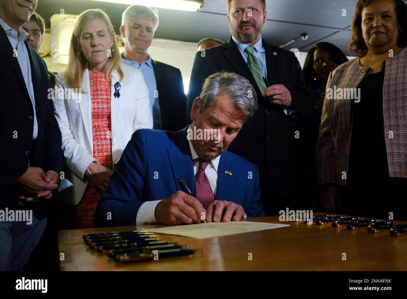 Gov. Brian Kemp signs a 1 billion tax cut bill in Bonaire, Ga., on