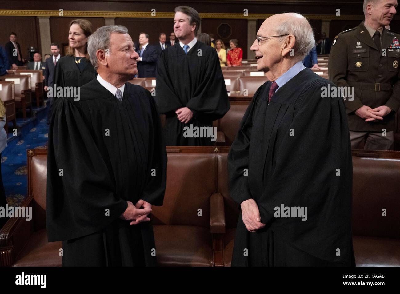 FILE Chief Justice of the United States John Roberts, left, speaks