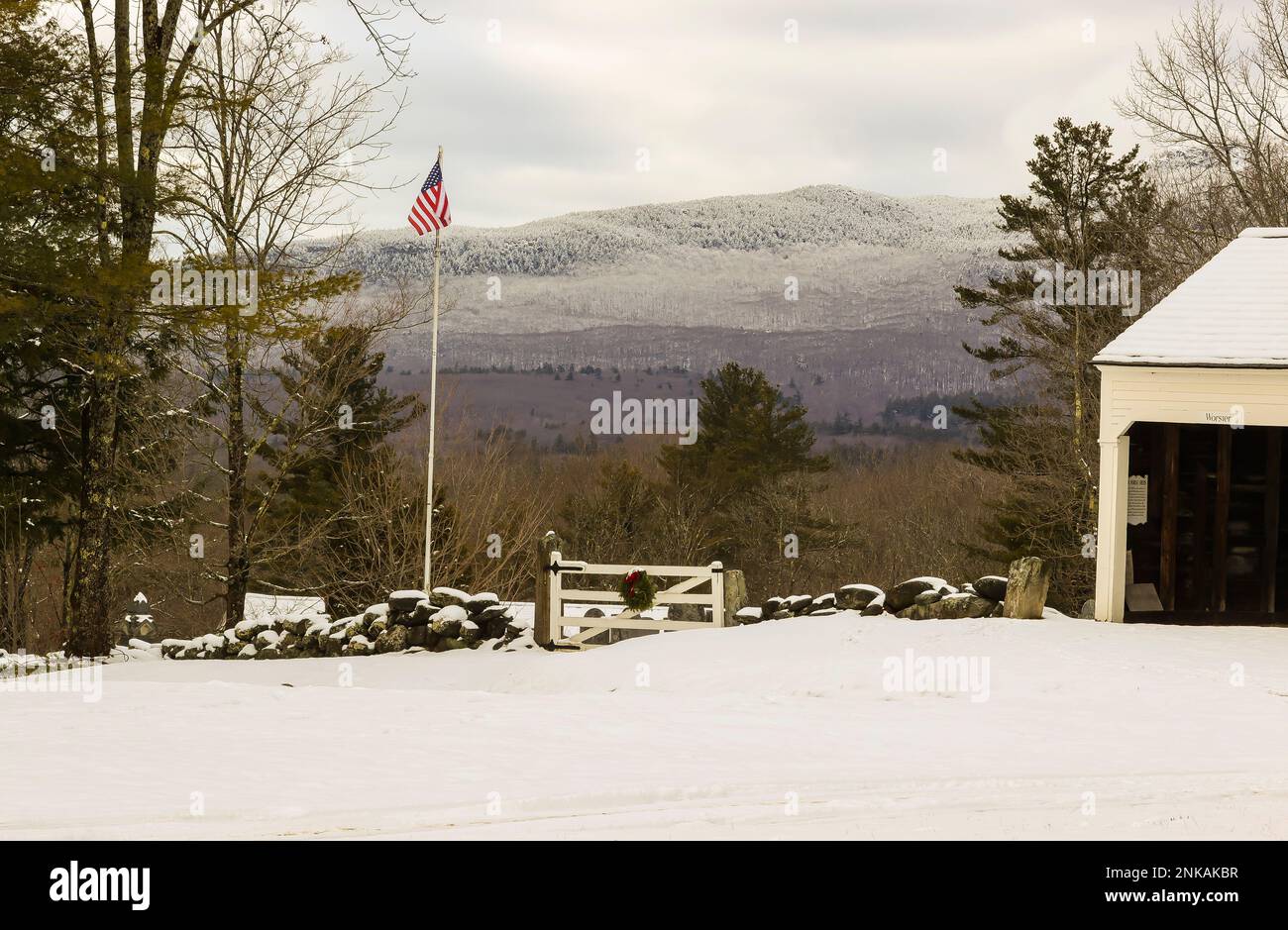 Well known peak in Southern New Hampshire. One of the most climbed mountains in the world.Small cemetery in background with horse stalls on right. Thi Stock Photo