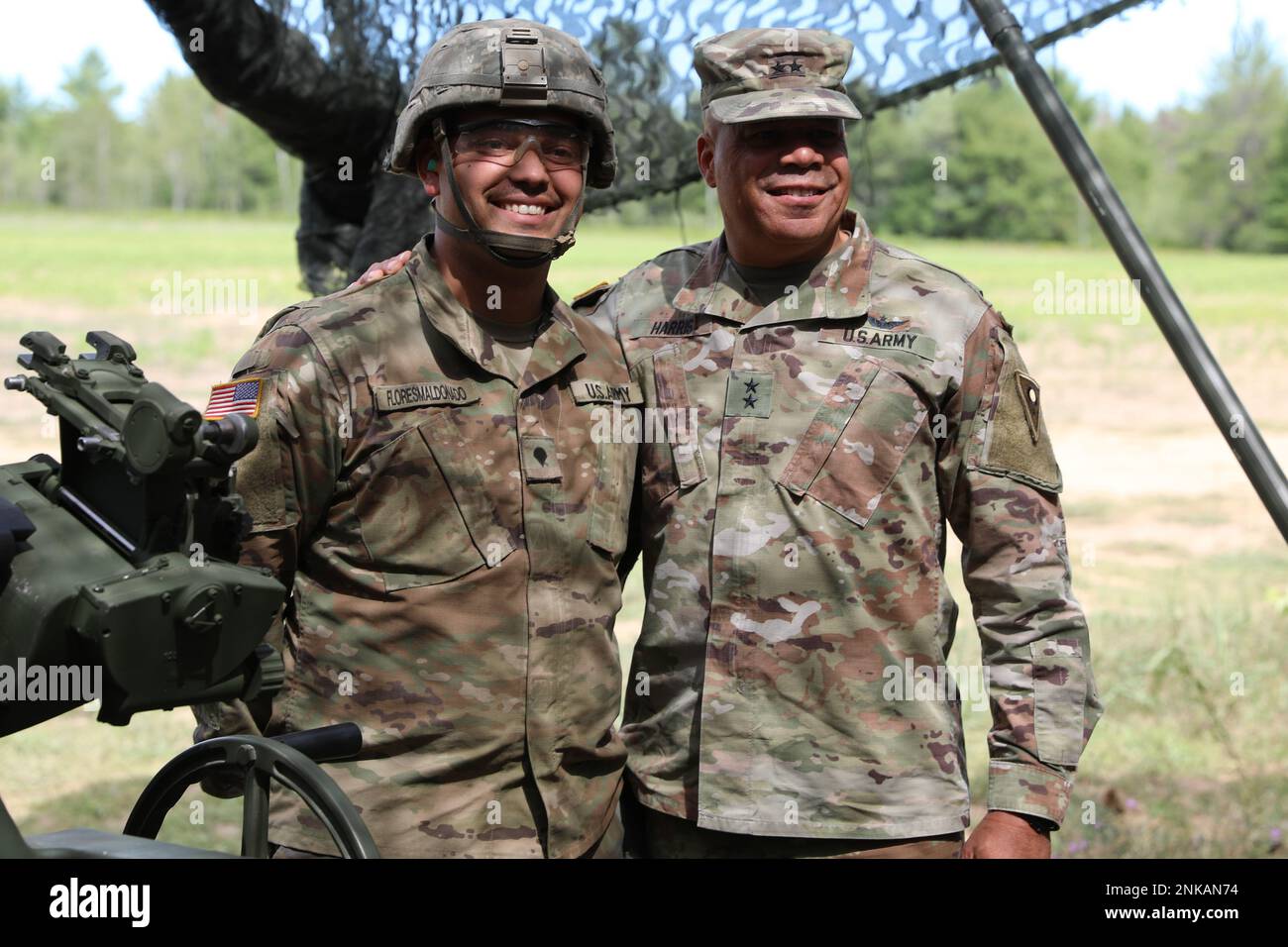 U.S. Army Spc. Mikael Floresmaldanado, left, a Cannon Crewmember assigned to Charlie Battery