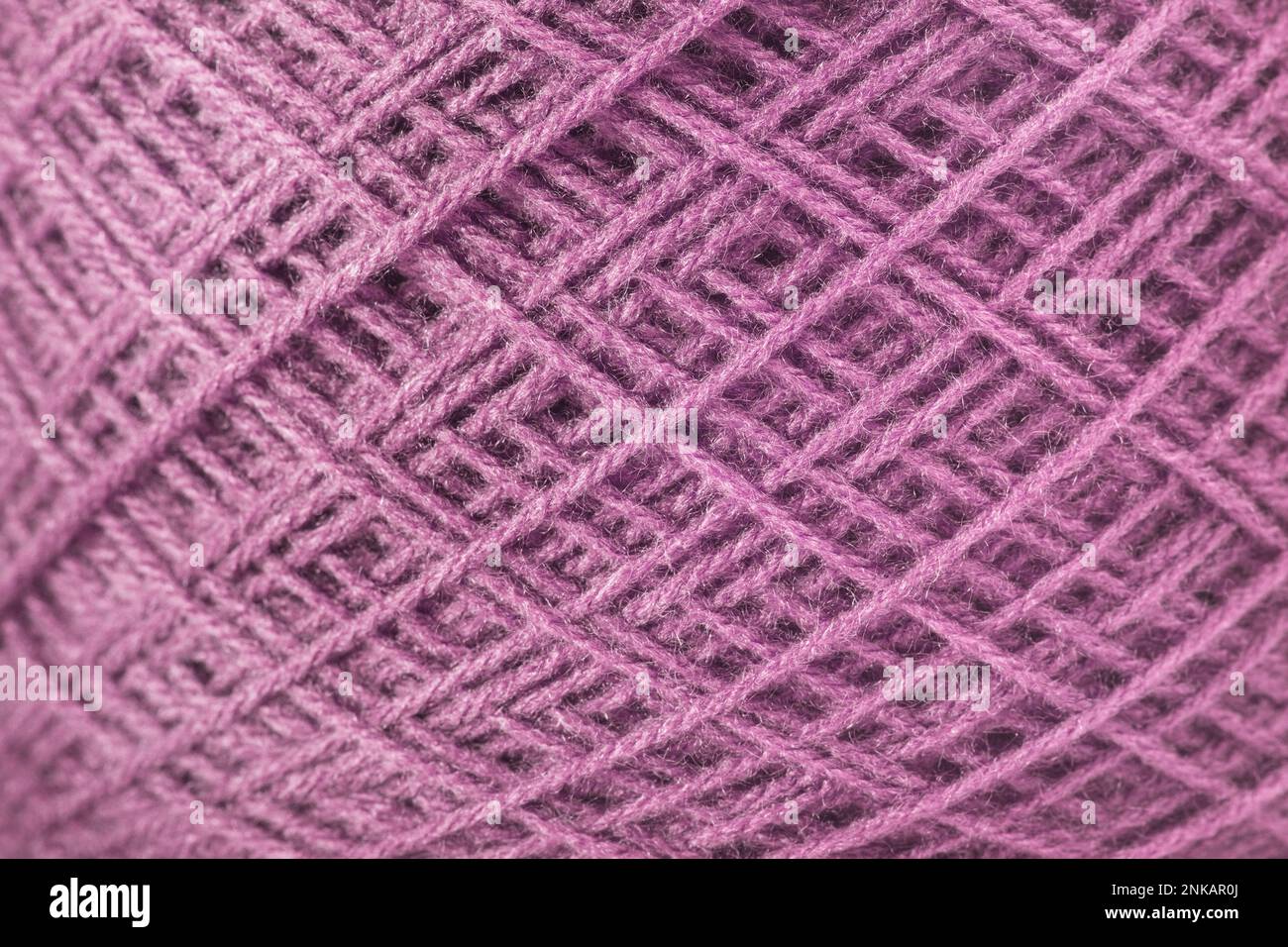Purple ball of wool in a close up view Stock Photo