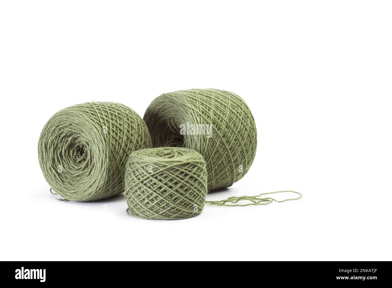 Green wool balls on a white background with copy space Stock Photo