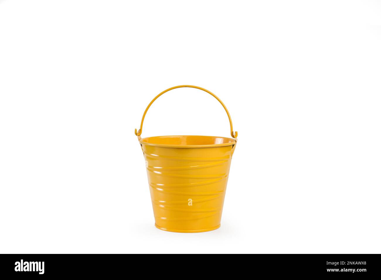 A yellow metal bucket with handle on a white background with copy space Stock Photo Alamy