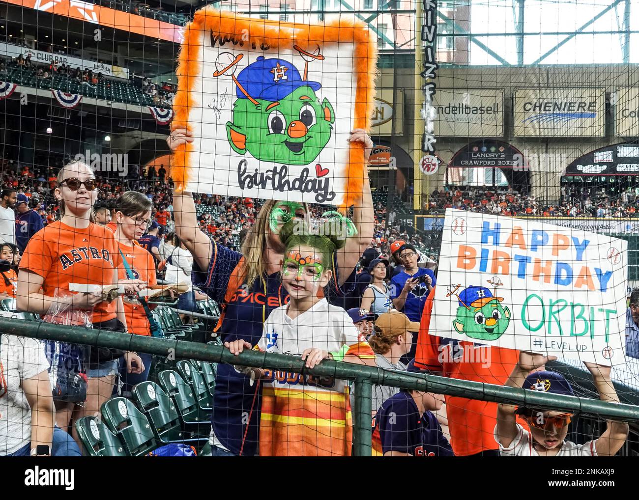 HOUSTON, TX - APRIL 24: Houston Astros fans hold up signs for the mascot  Orbit on his birthday celebration during the baseball game between the  Toronto Blue Jays and Houston Astros on