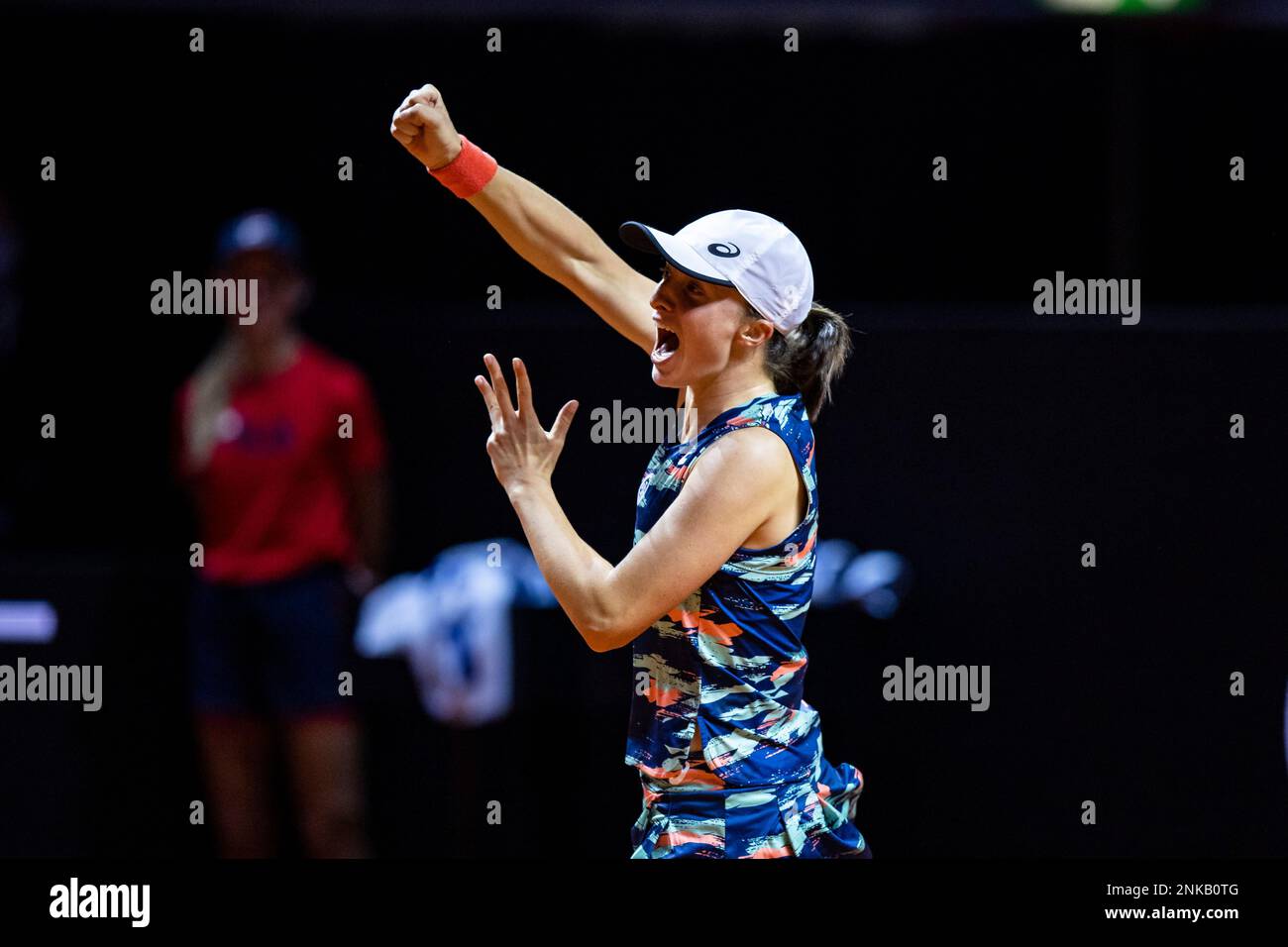 Poland's Iga Swiatek celebrates after beating Aryna Sabalenka from