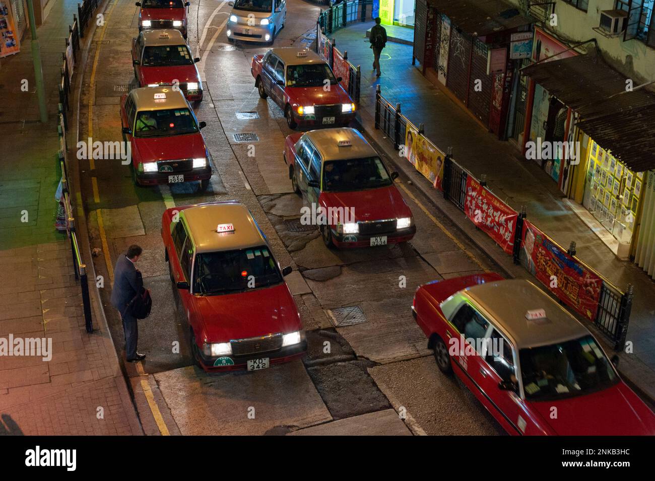 Taxis in the evening in Hong Kong's Central District. Stock Photo