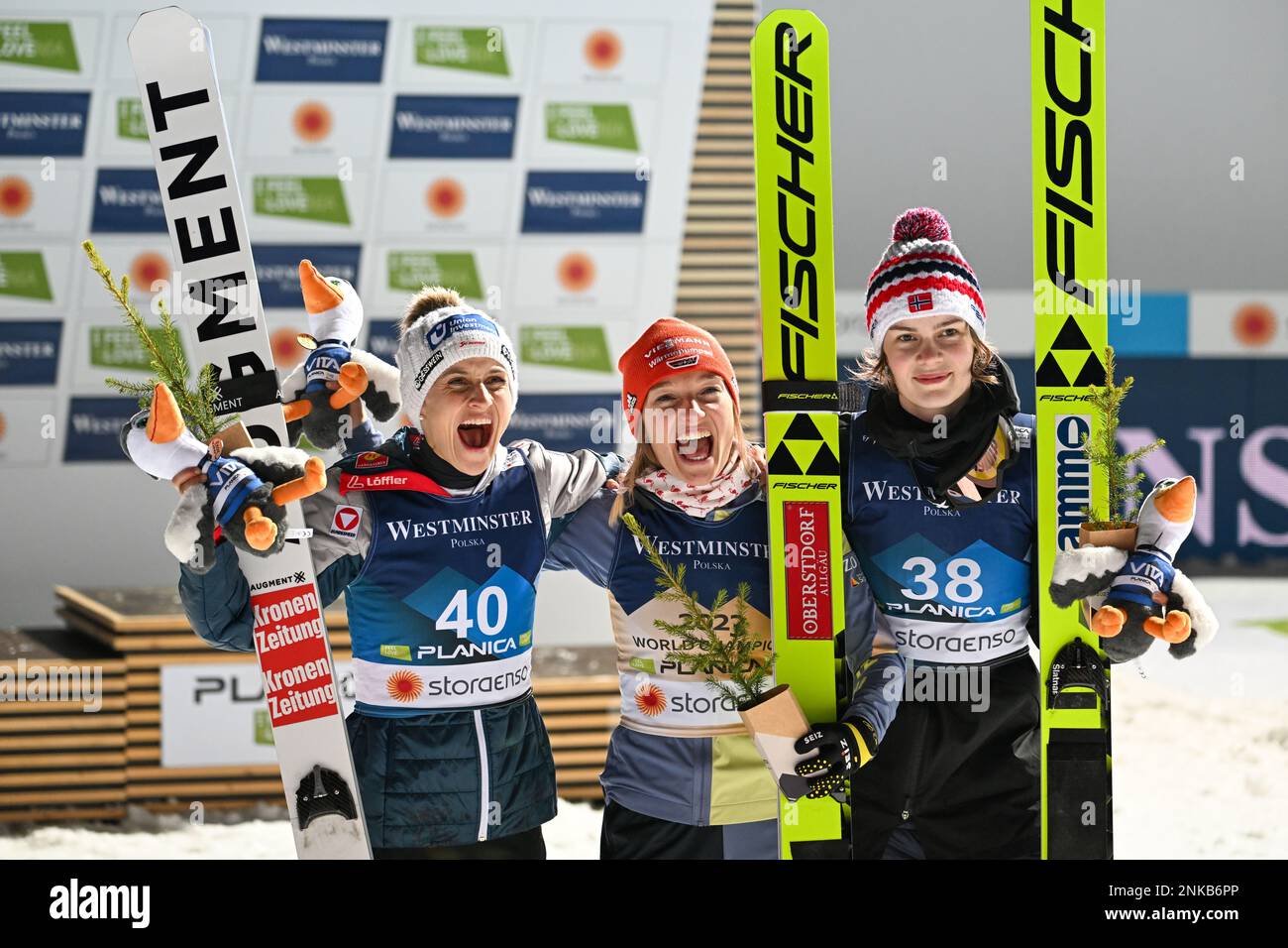 Planica, Slovenia. 23rd Feb, 2023. First placed Katharina Althaus (C) of Germany, second placed Eva Pinkelning (L) of Austria and third placed Anna Odine Stroem (R) of Norway celebrate on the podium for the Women's HS102 Ski Jumping competition at the FIS Nordic Skiing World Championships. Credit: SOPA Images Limited/Alamy Live News Stock Photo