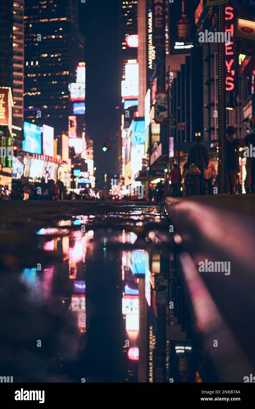 Blurred lights of the TImes Square in New York City at night. High ...