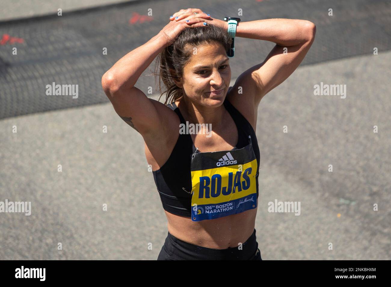 BOSTON, MA - APRIL 18: Nell Rojas of the United States of America reacts to  completing the Boston Marathon on April 18, 2022 on Boylston Street in  Boston, MA. Rojas finished with