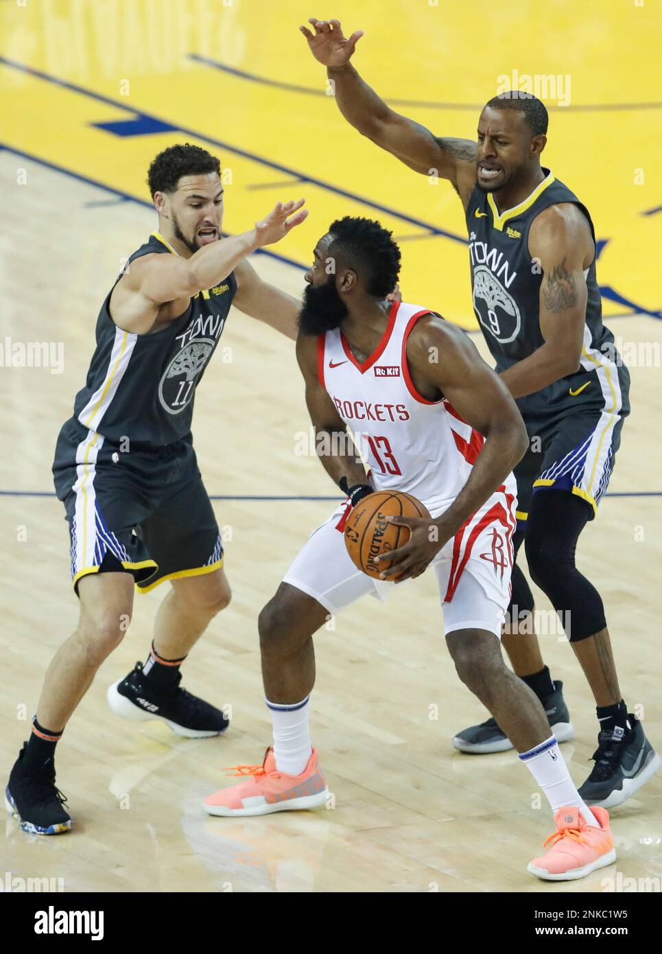Houston Rockets James Harden is double teamed by Golden State Warriors Klay Thompson and Andre Iguodala in the first quarter during game 2 of the Western Conference Semifinals between the Golden State