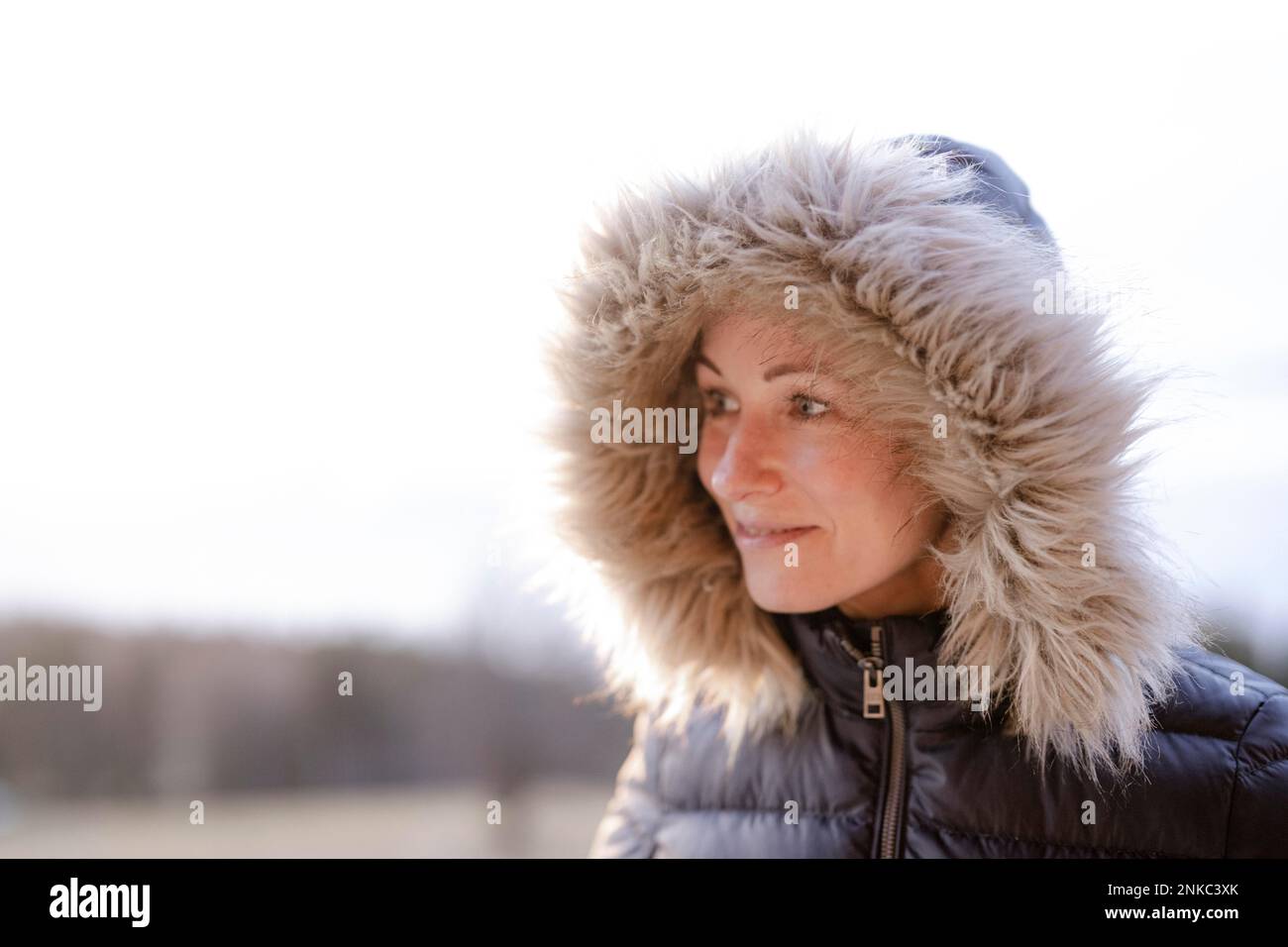 Woman with fur hood Stock Photo
