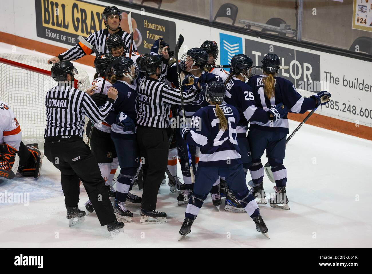 February 18, 2023: RIT Tigers and Penn State Nittany Lions players rough it up in the first period. The Rochester Institute of Technology Tigers hosted the Penn State Nittany Lions in an NCAA Woman's Hockey game at Gene Polisseni Center in Rochester, New York. (Jonathan Tenca/CSM) Stock Photo