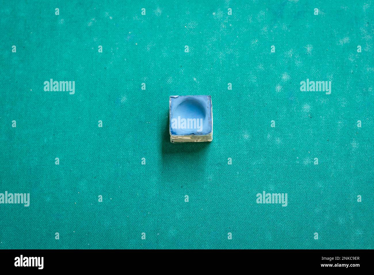 A snooker chalk on a pool table Stock Photo