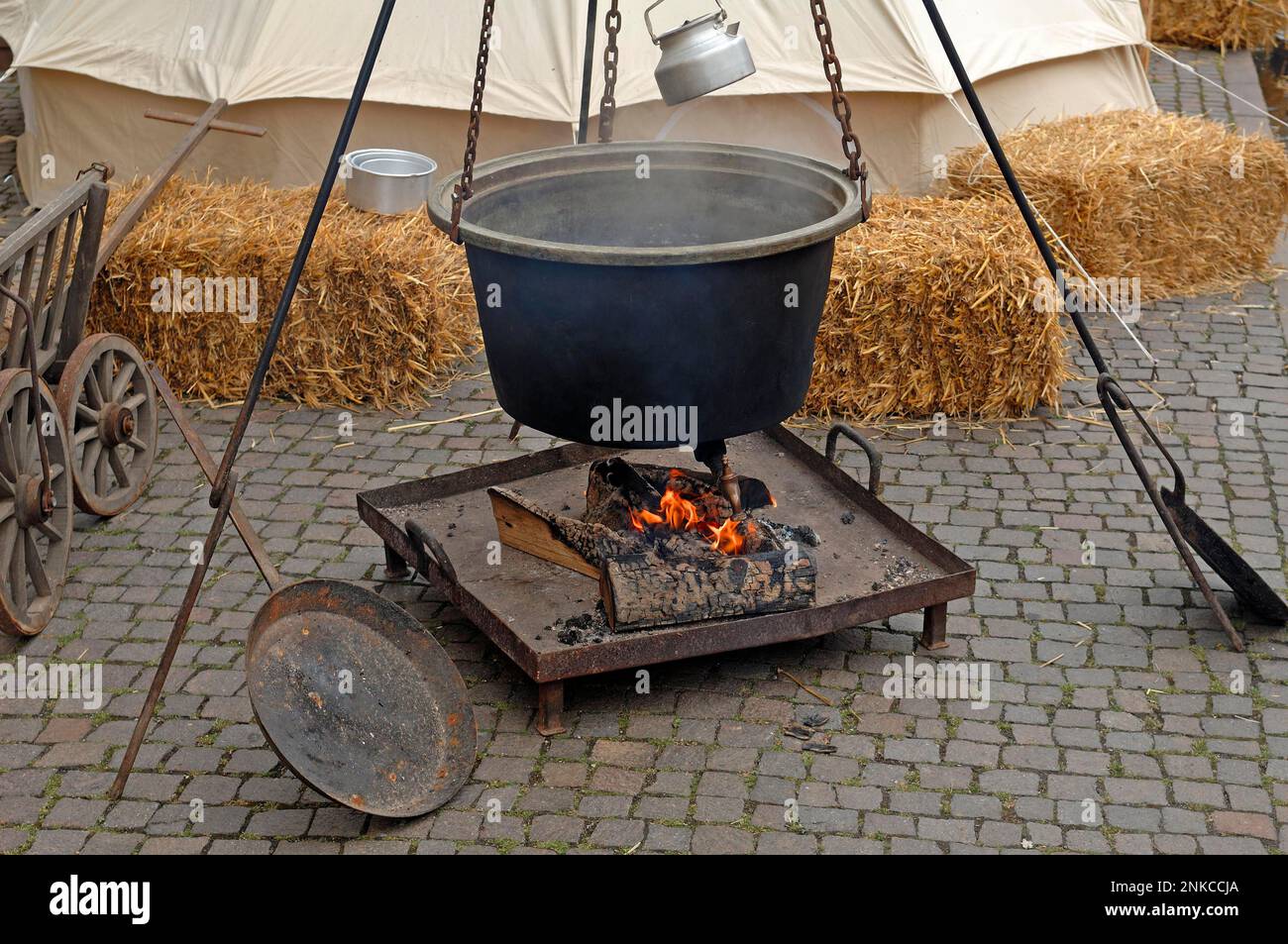 Old kettle over a fireplace at a historical festival in Gengenbach, Baden-Wuerttemberg, Germany Stock Photo