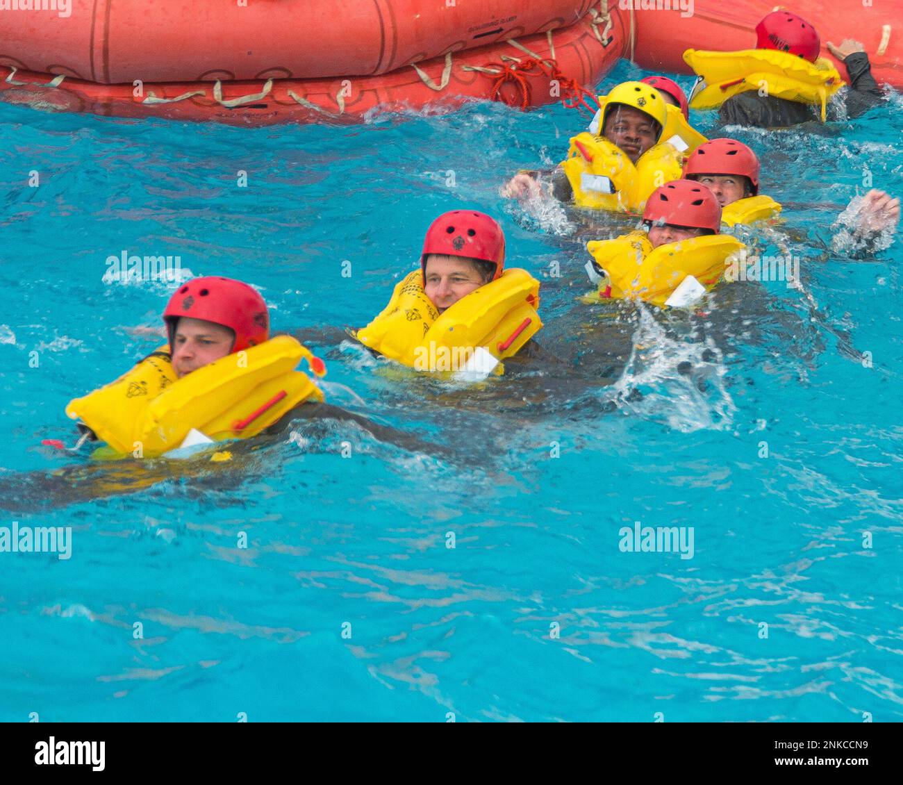 Aircrew members of the 127th Air Refueling Group, Selfridge Air National Guard Base, Michigan, participate in water survival training at a local water park on August 13, 2022. Part of a routine skill certification, the survival, evasion, resistance and escape training gave KC-135 Stratotanker aircrew and A-10 Thunderbolt II pilots practice on how to survive if their planes crash over a large body of water. Stock Photo