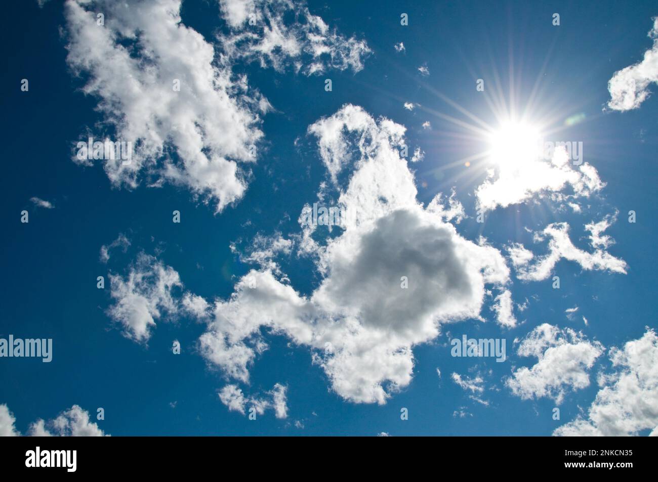 Cloudy sky and sun Stock Photo - Alamy