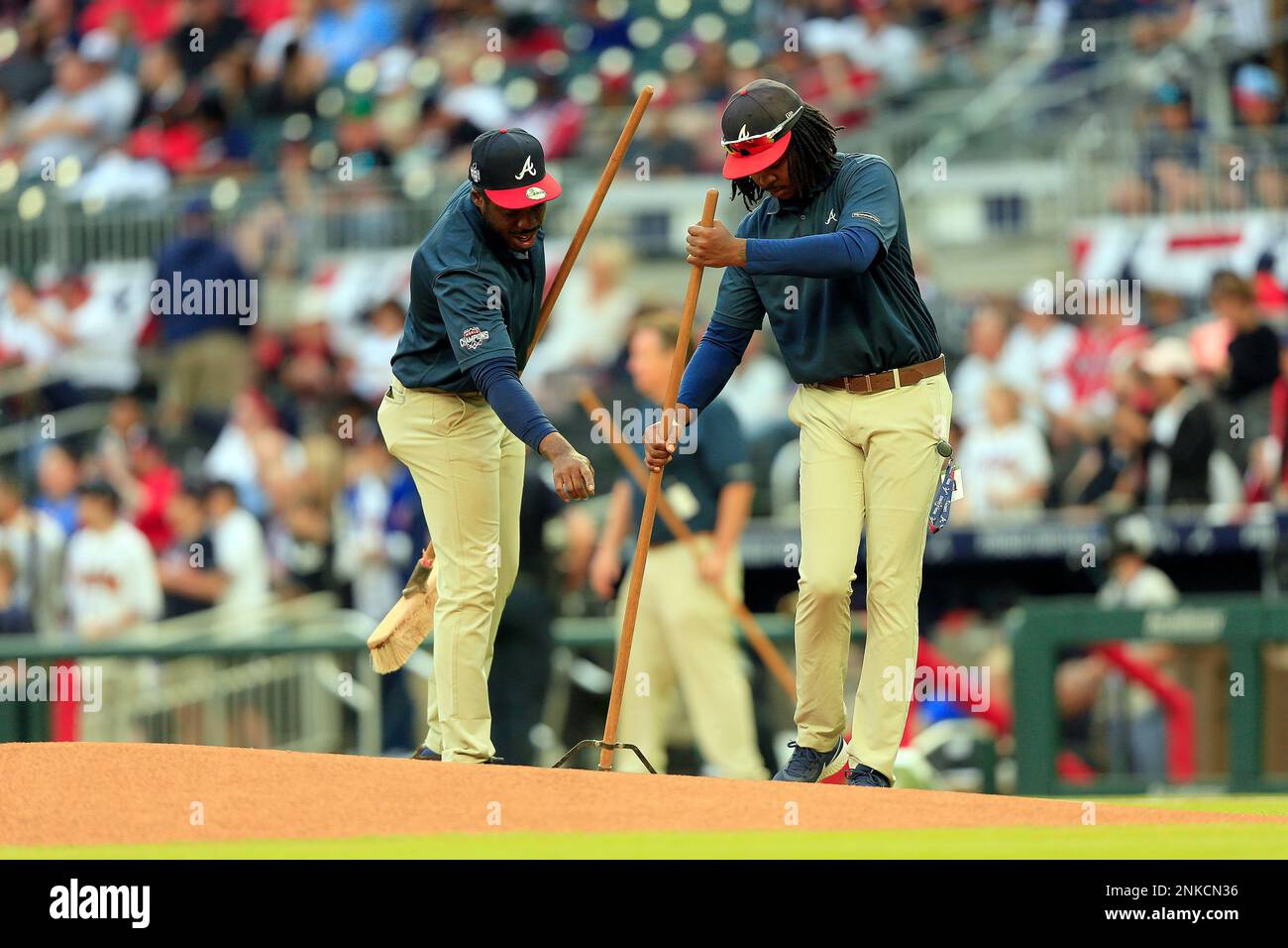 ATLANTA, GA APRIL 11 Members of the grounds crew prep the pitching