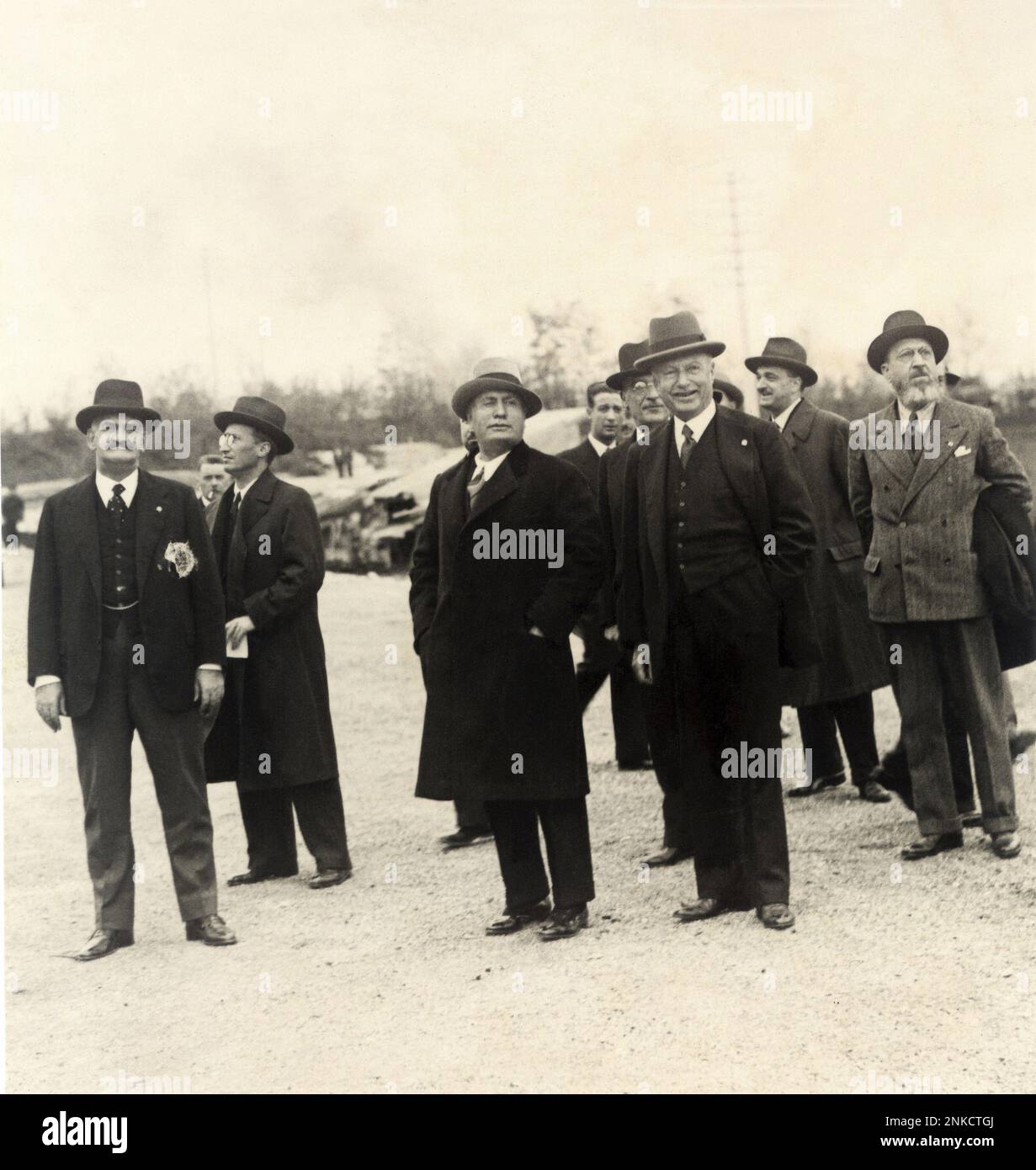 1932 , november , TORINO , ITALY  : The founder of italian FIAT car factory Giovanni AGNELLI ( 1866 -1945 ) meet the fascist Duce dictator Benito MUSSOLINI for a new model Car FIAT exibition  . First from the left in this photo the fascist count COSTANZO CIANO ( 1876 - 1939 ), father of Galeazzo Ciano married with Edda Mussolini  daughter of the Duce .  - INDUSTRY - CAR - INDUSTRIALI - AUTOMOBILI -  F.I.A.T. - INDUSTRIA AUTOMOBILISTICA ITALIANA - WWII - SECONDA GUERRA MONDIALE - FASCIST - FASCISMO - AUTARCHIA ---  Archivio GBB Stock Photo