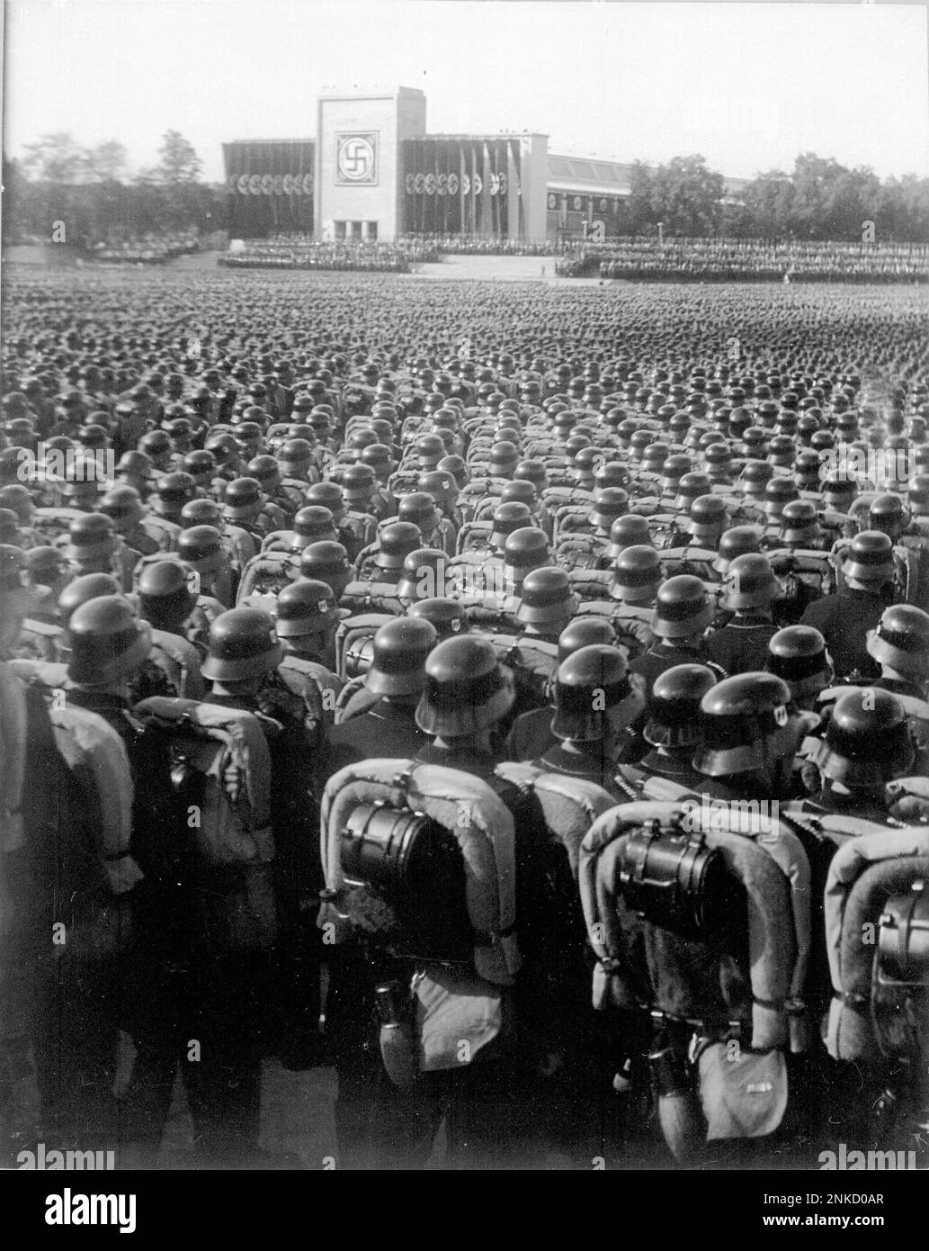 SS-VT in full marching order at the Nuremburg Rally in  1935. The  SS-Verfügungstruppe (SS-VT or V-Truppe)  was formed in 1934 as combat troops for the Nazi Party. On 17 August 1938 Adolf Hitler decreed that the SS-VT was neither a part of the Ordnungspolizei (regular police) nor the Wehrmacht, but military-trained men at the disposal of the Führer.  By 1940 these military SS units had become the nucleus of the Waffen-SS. Stock Photo