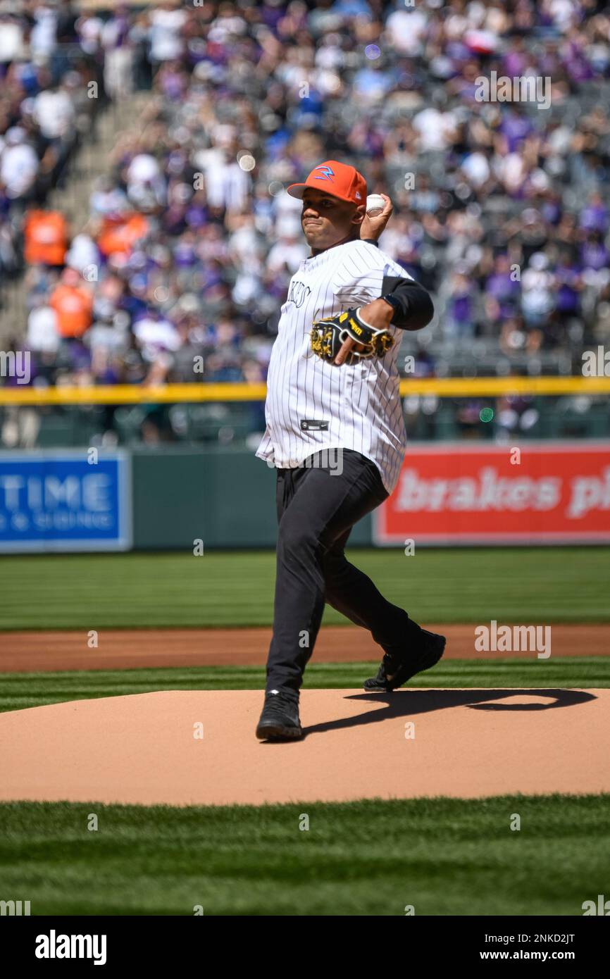 DENVER, CO - APRIL 08: Denver Broncos QB Russell Wilson throws out the fist  pitch during the Colorado Rockies Opening Day game against the Los Angelas  Dodgers on April 8, 2022 at