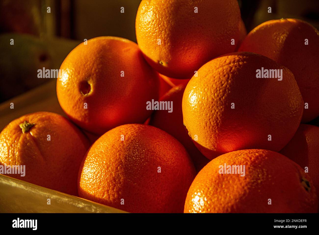 A stacked pile of oranges on a fruit cart, Roatan, Honduras. Stock Photo