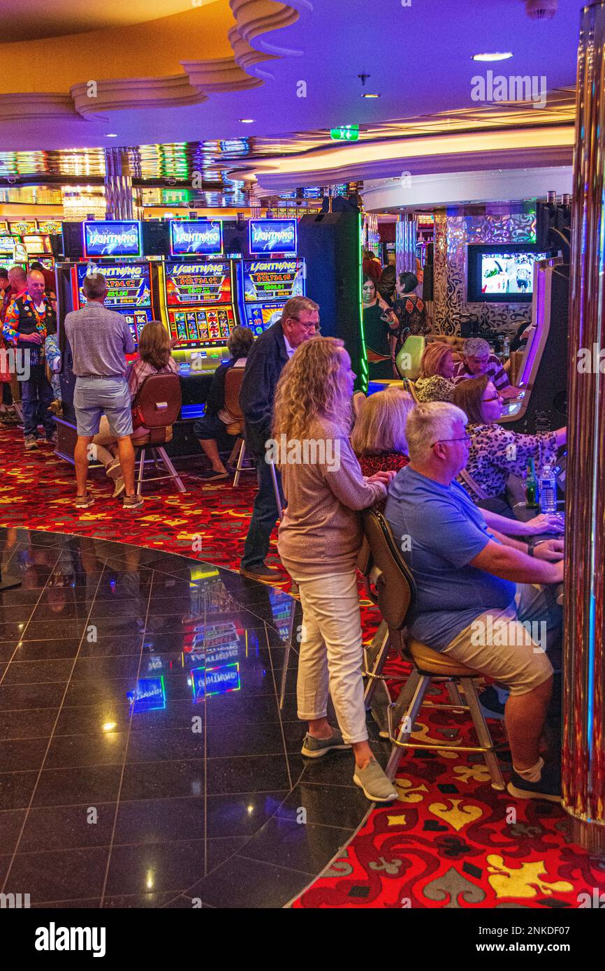 Playing the slots in the casino aboard the Allure of the Seas, Royal Caribbean cruise lines Stock Photo