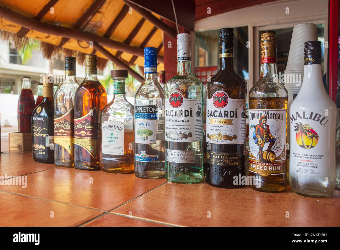 A row of bottles containing different kinds of alcohol, Cozumel, Mexico Stock Photo Alamy