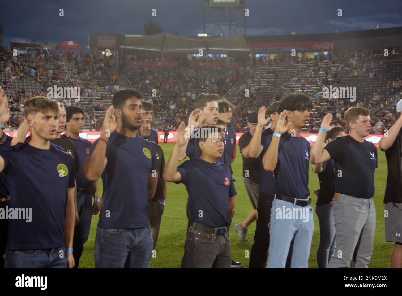 Future Sailors and future military members recite the oath of enlistment performed by Capt
