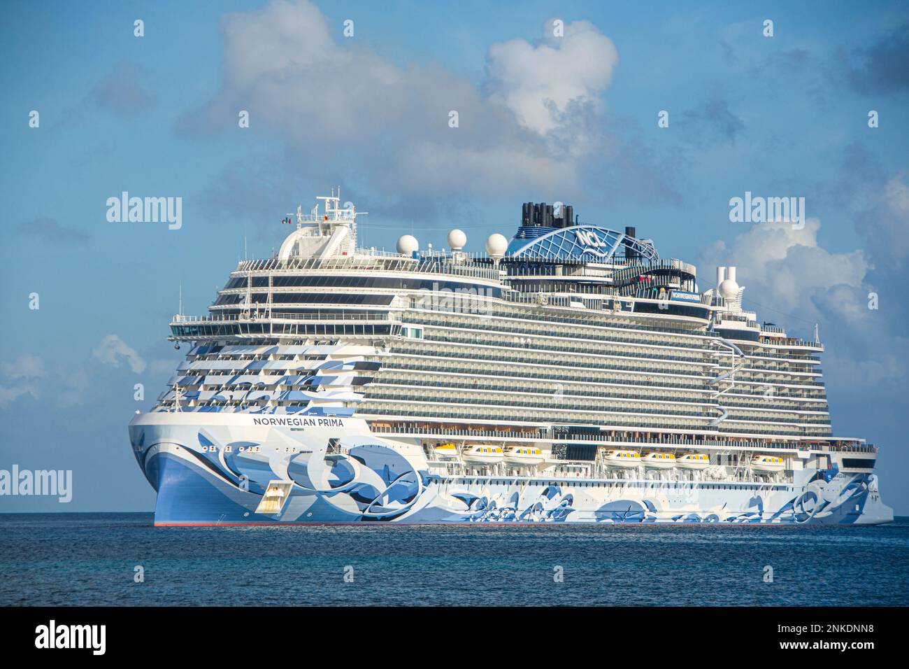 A cruise ship of Norwegian origin heading towards Cozumel, Mexico. Stock Photo