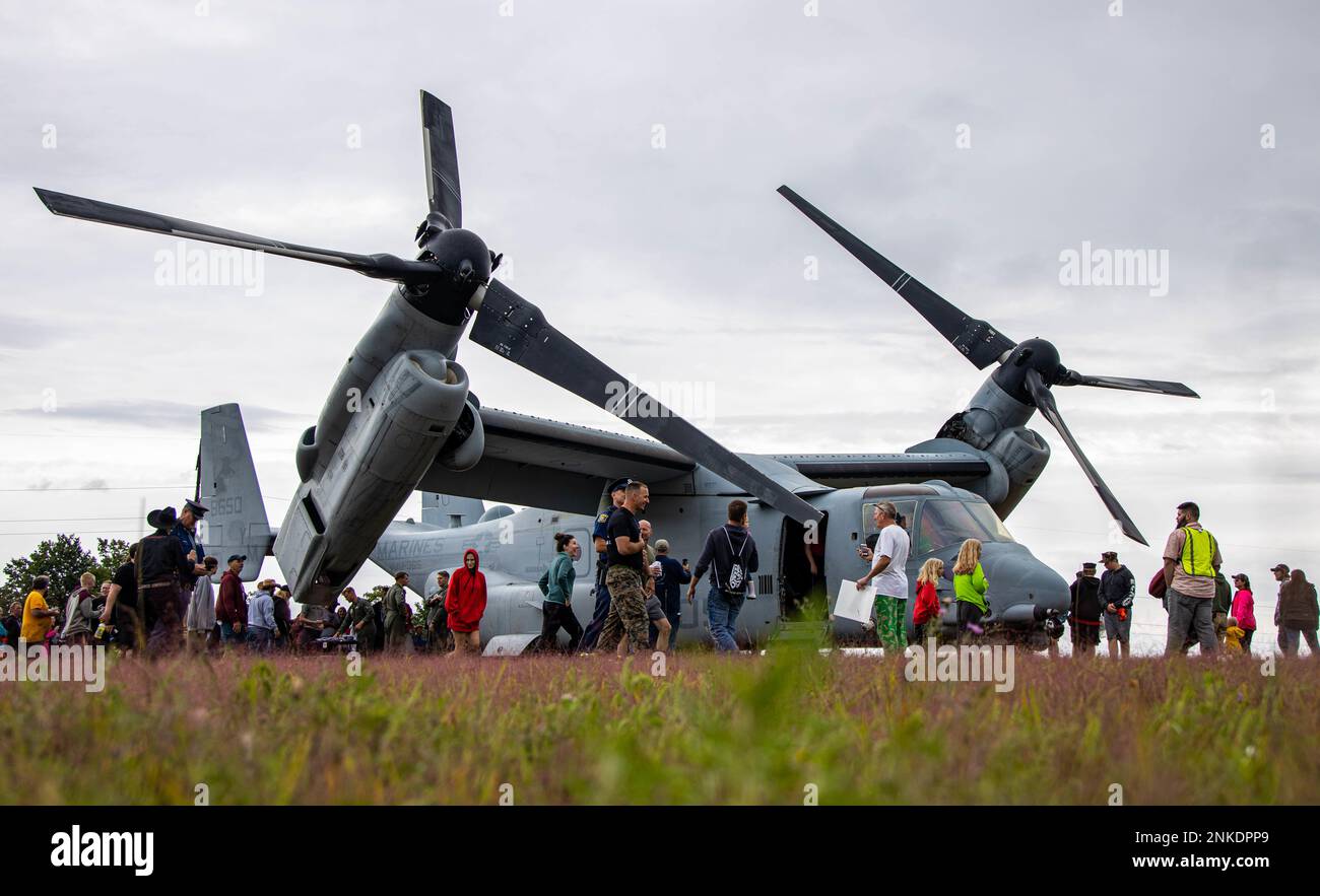 U.S. Marines with Recruiting Station Lansing and Marine Medium Tiltrotor Squadron 365 give tours of a MV-22 Osprey at the Drew Kostic Memorial 5K near Traverse City, Michigan on August 13, 2022. The U.S. Marine Corps provided static displays, tours, and demonstrations of aircraft to allow the familiarization with the equipment and opportunities the Marine Corps offers. Stock Photo