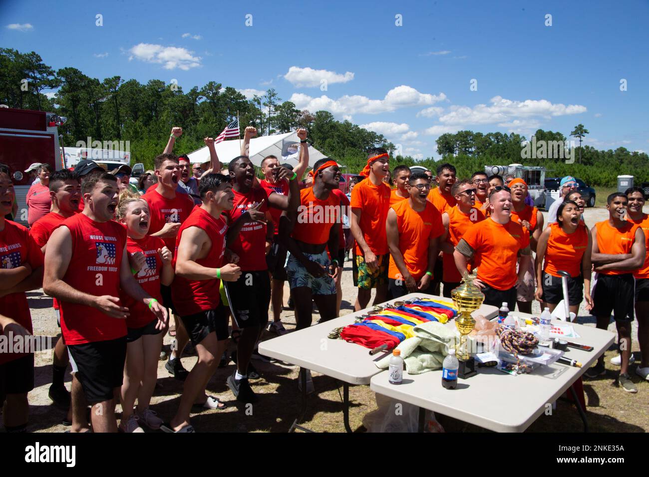 Paddle teams with the Single Marine Program receive the result of their final race at the 12th Annual Dragon Boat Races and Festival in Oriental, North Carolina, Aug. 13, 2022. The Neuse Winds Freedom Riders came in first place by less than one second. Stock Photo
