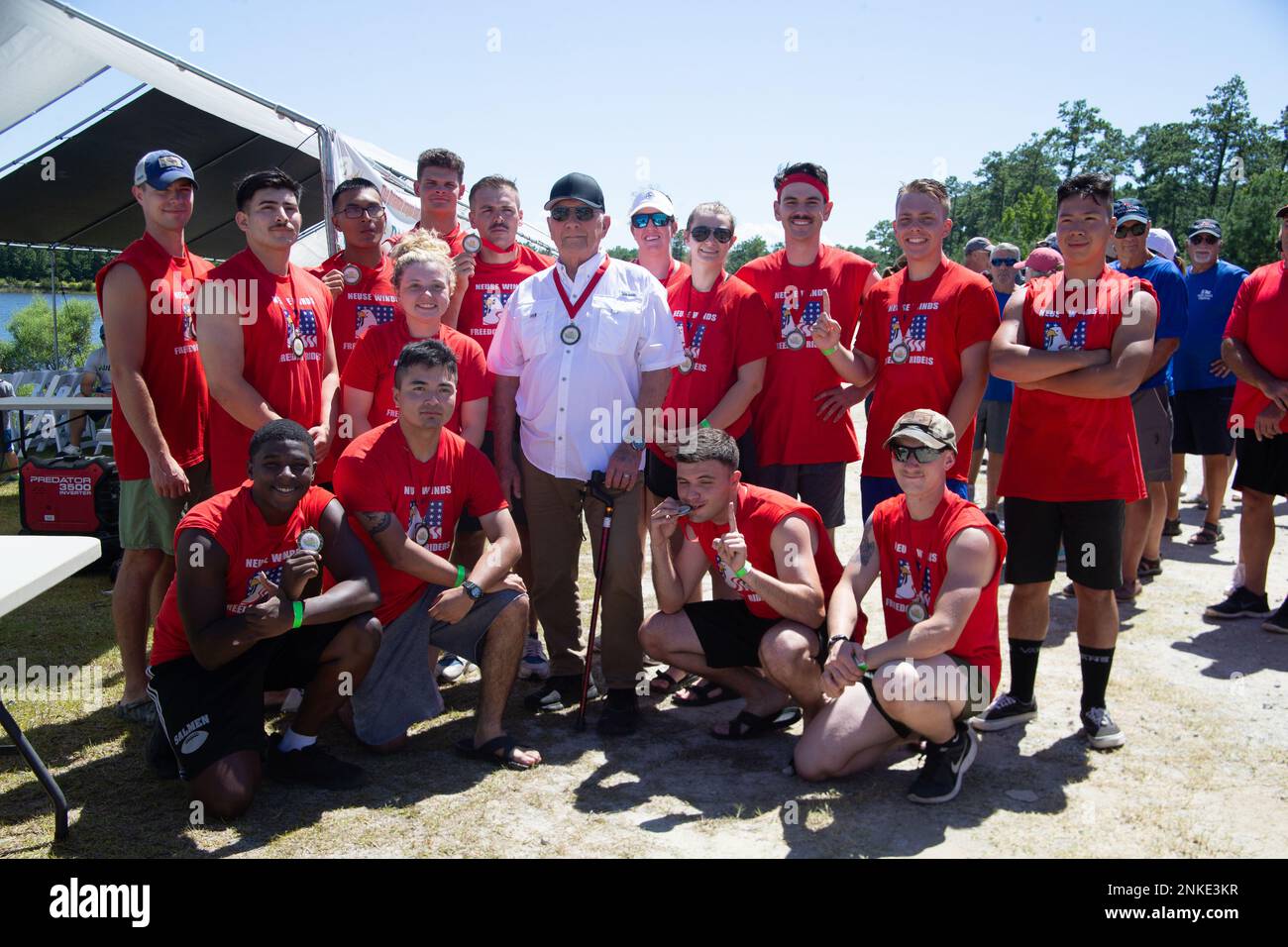 The Neuse Winds Freedom Riders, a paddle team comprised of Marines with the Single Marine Program, take a photo with their sponsor, Dr. John Windrith, during the 12th Annual Dragon Boat Races and Festival in Oriental, North Carolina, Aug. 13, 2022. Windwrith sponsors the Neuse Wind Freedom Riders every year. Stock Photo