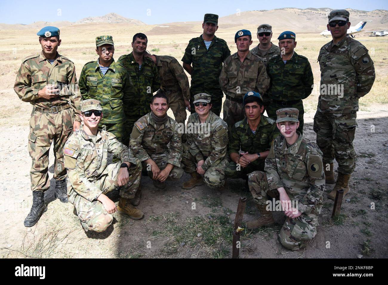 U.S. National Guard Soldiers pose alongside their partners from the Tajikistan Ministry of Defense during the exercise “Regional Cooperation 22” Aug. 14, 2022, at a training site near Dushanbe, Tajikistan. RC 22 is an annual, multi-national U.S. Central Command-sponsored exercise conducted by U.S. forces in partnership with Central and South Asia nations. Stock Photo