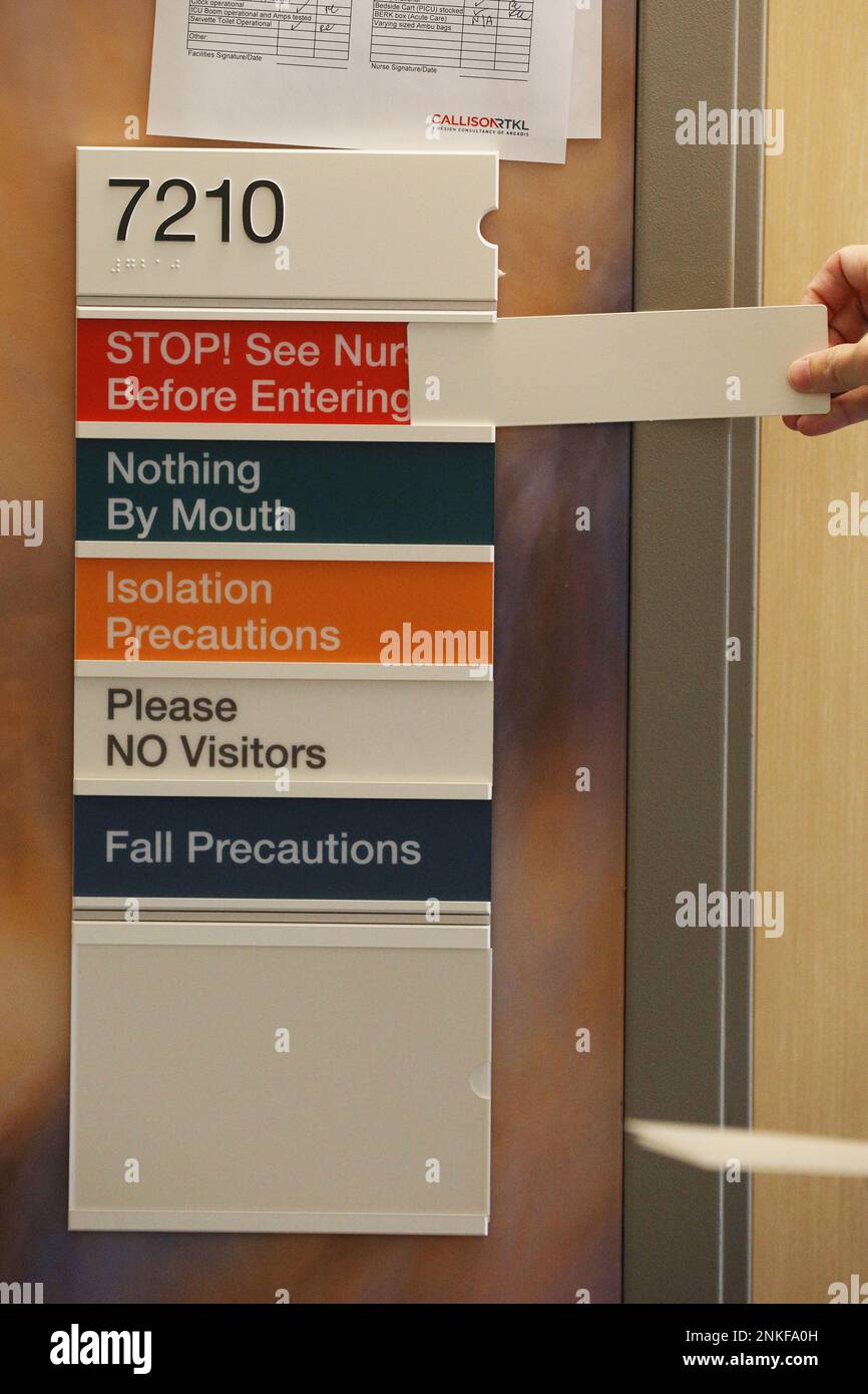 A sign board displays instructions that can be displayed by removing a ...