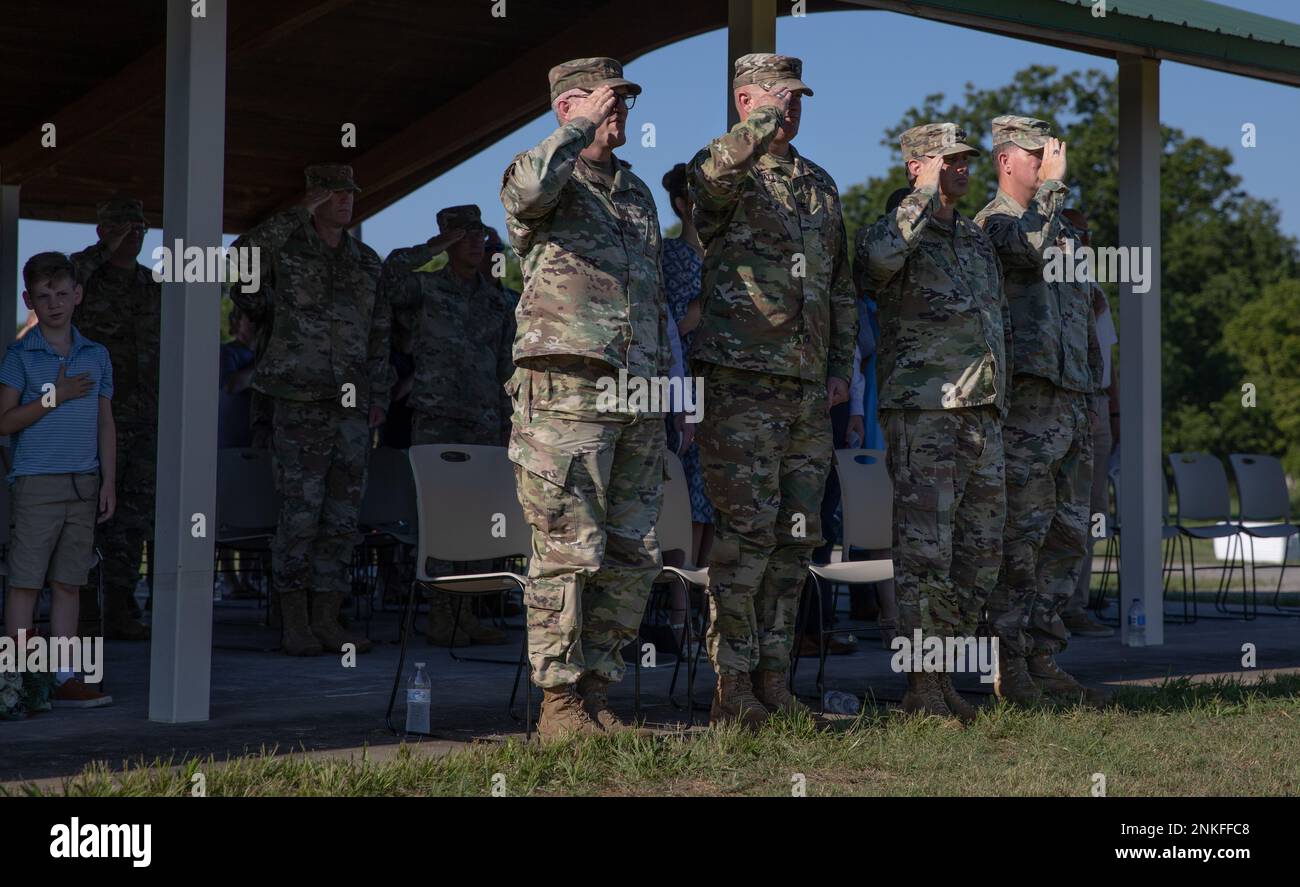 Oklahoma National Guard Soldiers salute during the national anthem at a change of command ceremony for the 45th Infantry Brigade Combat Team, Camp Gruber Training Center, Oklahoma, Aug. 14, 2022. Col. Colby Wyatt served as the commander of the 45th IBCT for three years and relinquished command to Col. Andrew Ballenger. (Oklahoma Army National Guard photo by Spc. Danielle Rayon) Stock Photo
