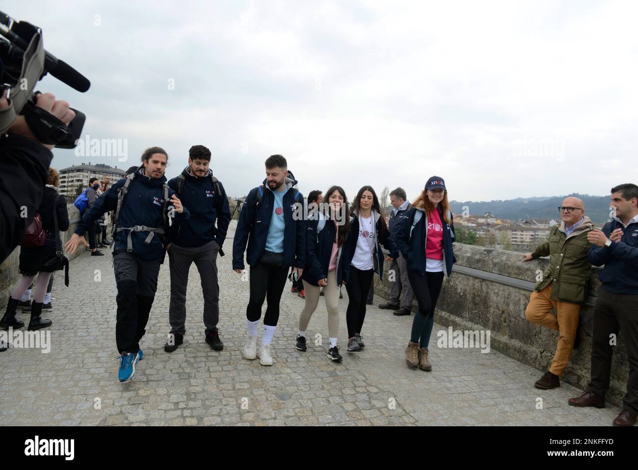 L-R) The singers Roi Méndez and Luis Cepeda; the instagramers Xurxo  Carreño; Natalia Maquieira and Tamara García and the actress Cristina  Castaño, walk on the Roman Bridge of Ourense, on March 30,