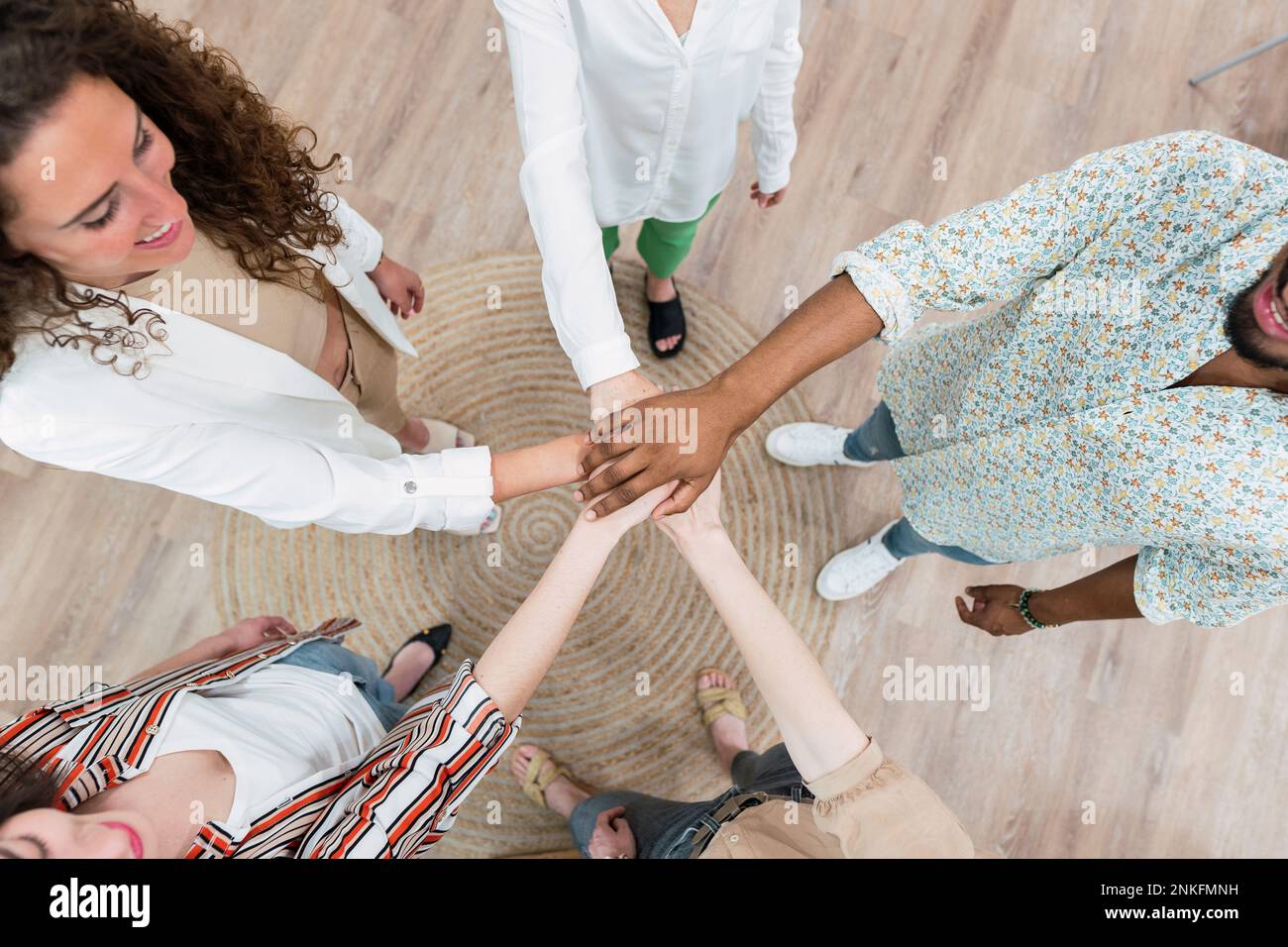 United business team stacking hands Stock Photo Alamy
