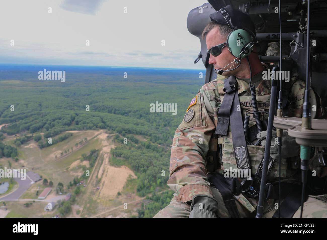 U.S. Army Cpt. Tucker Palmatier, a Cyber Electronic Warfare Officer assigned to the 37th Infantry Brigade Combat Team, monitors Versatile Radio Observation and Direction (VROD) equipment during a training mission, August 14, 2022, at Camp Grayling, Michigan. The exercise, which was in partnership with the National Guard Bureau, allowed Palmatier to test the equipment in a variety of environments, increasing the warfighting capabilities and readiness of the 37th IBCT. Stock Photo