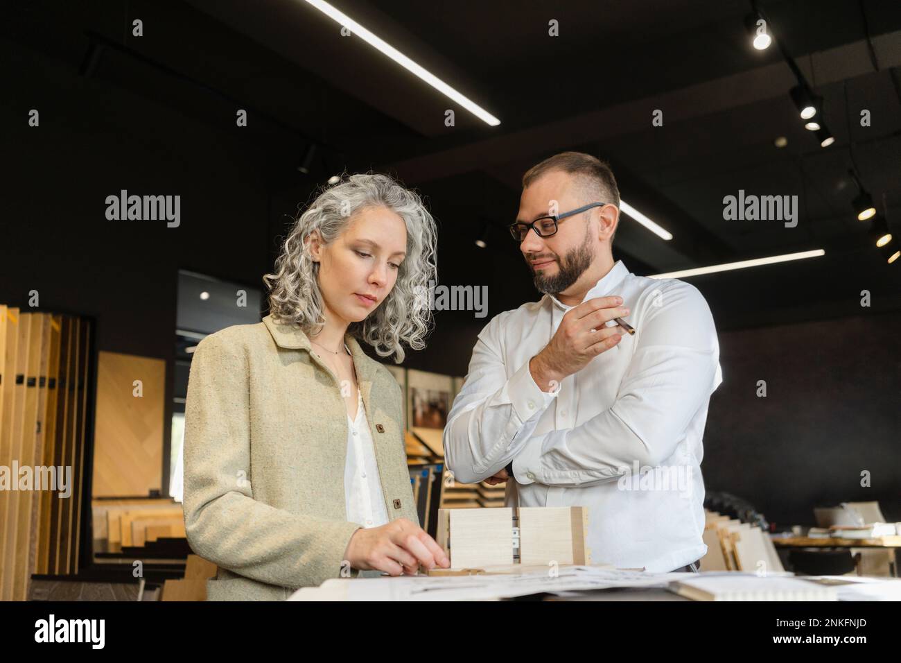 Two colleagues working on project in architect's office together Stock Photo