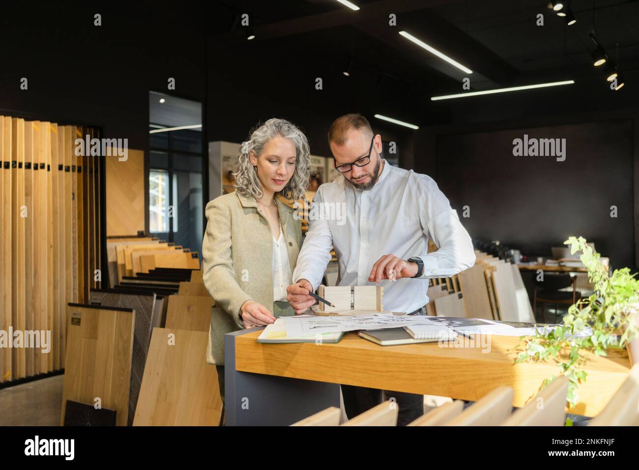 Two colleagues working on project in architect's office together Stock Photo
