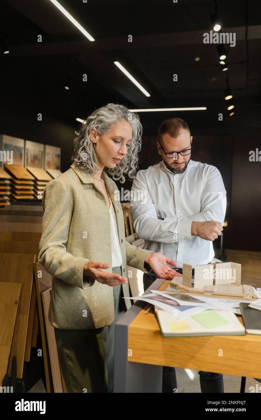 Two colleagues working on project in architect's office together Stock Photo